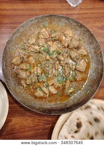 Eating Tasty Chicken Karahi In Restaurant With Friends And Family