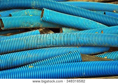 Blue Curvilinear Tubes For Industry In City.