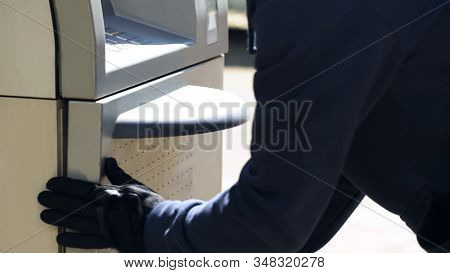 Security Man Checking Safety Of Automated Teller Machine Cash-in-transit Service