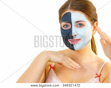 Girl With Black White Mud Mask On Face