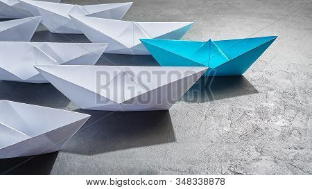 Business Concept, Paper Boat, The Key Opinion Leader, The Concept Of Influence. One Blue Paper Boat 