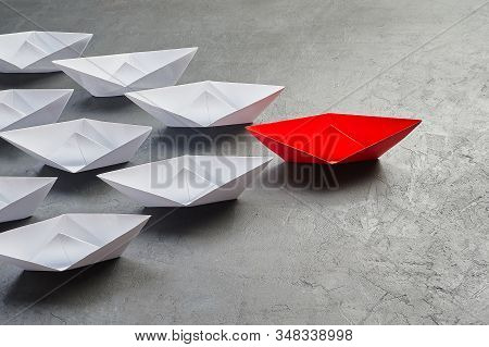 Business Concept, Paper Boat, The Key Opinion Leader, The Concept Of Influence. One Red Paper Boat A