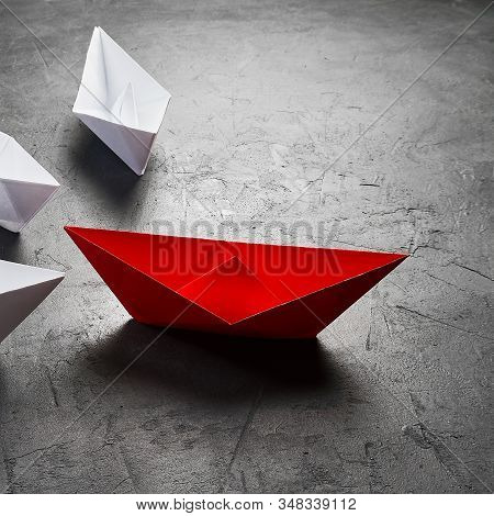 Business Leadership Concept, Paper Boat, The Key Opinion Leader, The Concept Of Influence. One Red P