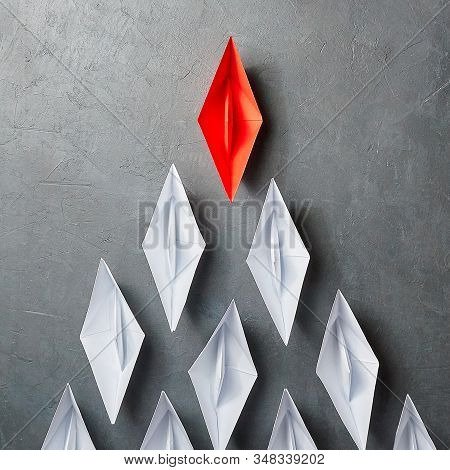 Business Concept, Paper Boat, The Key Opinion Leader, The Concept Of Influence. One Red Paper Boat A