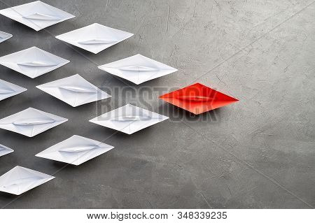 Business Concept, Paper Boat, The Key Opinion Leader, The Concept Of Influence. One Red Paper Boat A