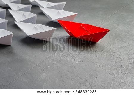 Business Leadership Concept, Paper Boat, The Key Opinion Leader, The Concept Of Influence. One Red P