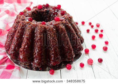 Chocolate Muffin With Cherry, Cranberry And Lecker On A White Wooden Background. Close-up.