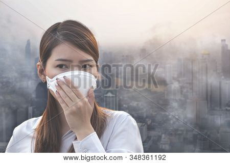 City Air Pollution Concept. Close Up Woman Wearing N95 Mask To Air Pollution In Bangkok City