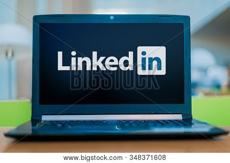 Poznan, Pol - Dec 11, 2019: Laptop Computer Displaying Logo Of Linkedin, An American Business And Em