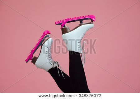Figure Skating Is A Winter Sport And Leisure. Slender Female Legs In Skates For Figure Skating. Skat