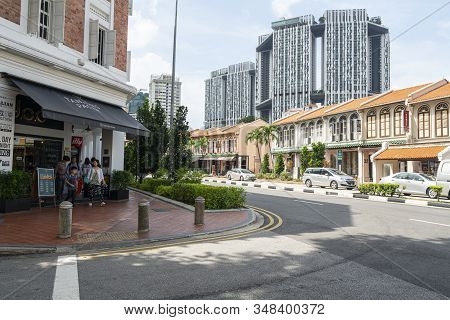 Singapore.  January 2020.  Typical Shophouses In The City Center With The Pinnacle Duxton Building I
