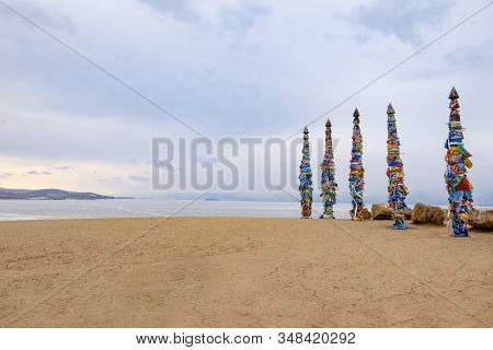 Shamanistic Wooden Ritual Totems With Colorful Ribbons At Cape Burhan, Baikal, Olkhon Island, Siberi