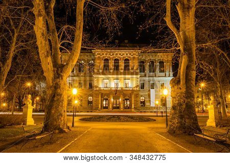 Croatia, City Of Zagreb, Academy Palace Building And Zrinjevac Park In The Night, Long Exposure