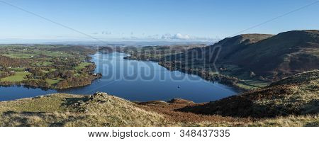 Epic Autumn Fall Landscape Of Ullswater And Surrounding Mountains And Hills Viewed From Hallin Fell 