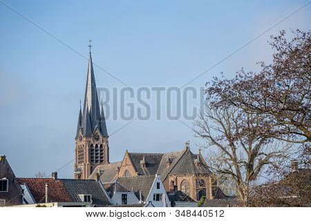 The Steeple Of The Old Church In Breukelen, The Netherlands. Because The Surrounding Houses Are Buil