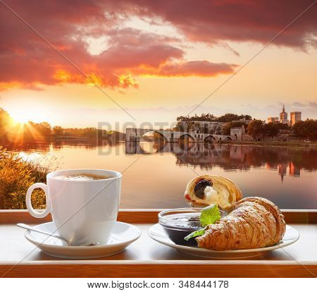 Coffee With Croissants Against Avignon Old Bridge In Provence, France
