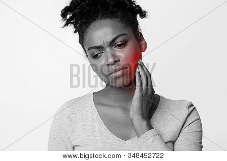 Exhausted Afro Girl Suffering From Acute Pulpitis, Monochrome Photo With Highlighted Sore Zone