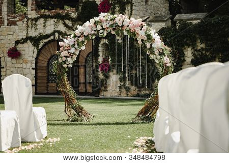 Blooming Decoration Of Wedding Arch With Roses, Hydrangea And Eucalyptus. Wedding Wood Decoration. W