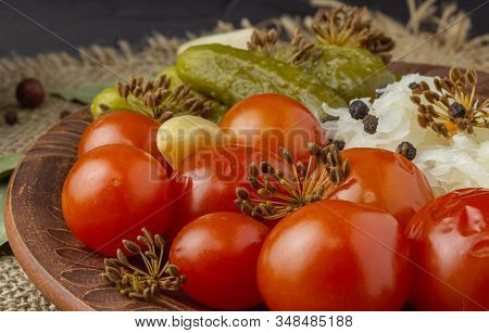 Side View Of A Winter Dish Of Homemade Pickles Of Cucumbers, Tomatoes, Cabbage And Dill Flowers