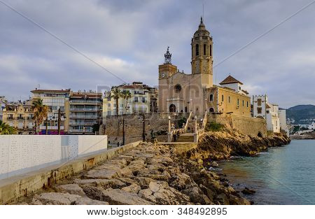 Sitges, Spain - January 2, 2020: Cityscape Of Sitges. The Catholic Church In The Town Of Sitges