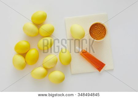 Above View Of Pastel Yellow Easter Eggs With Natural Color Dye Arraigned In Minimal Composition On W