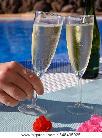 Pool Party With Two Glasses With  Bubbles White Champagne Or Cava Wine, Romantic Event Or All Inclus