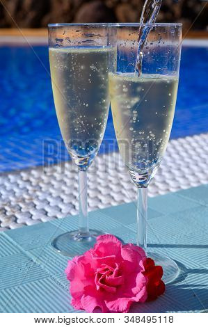 Pool Party With Two Glasses With  Bubbles White Champagne Or Cava Wine, Romantic Event Or All Inclus