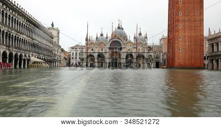 Basilica Of Saint Mark In Venice In Italy With Tide On The Square