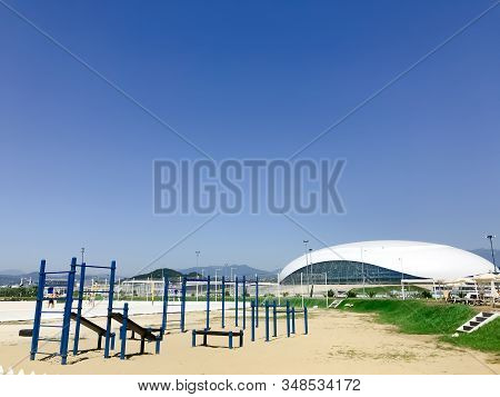 Sochi/russia - August 2019: Playground On The Beach Of Adler City And «shayba» Arena On The Backgrou