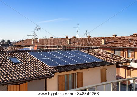 Solar Panels On Suburban Italian Home. Photovoltaic Power Plant. Regenerative Energy System Electric