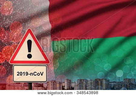 Madagascar Flag And Coronavirus 2019-ncov Alert Sign. Concept Of High Probability Of Novel Coronavir