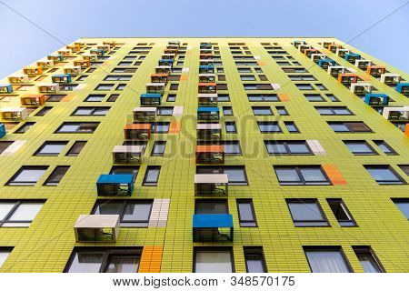 Moscow. Russia. Summer 2019. Multystoried Houses. New Apartment Buildings. Yellow Facade With Bright