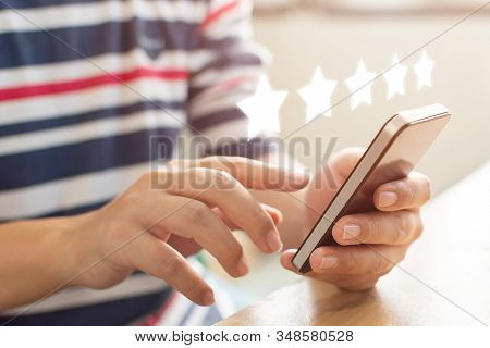 Customer Service Experience And Business Satisfaction Survey. Close-up Image Of Male Hands Using Mob