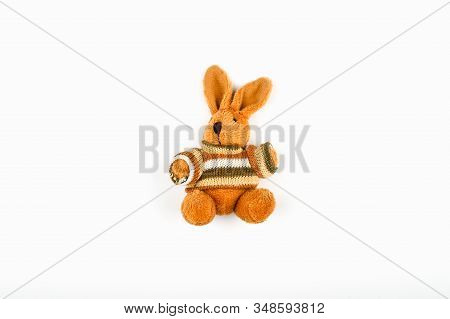 Brown Plush Hare On A White Background. Old Plush Brown Retro Hare On White Wall Background.