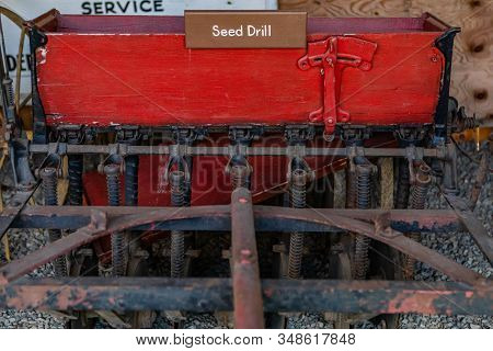 Rusted Seed Drill From The Late 19th Century. Antique Horse-drawn Seed Drill. Agricultural Museum In