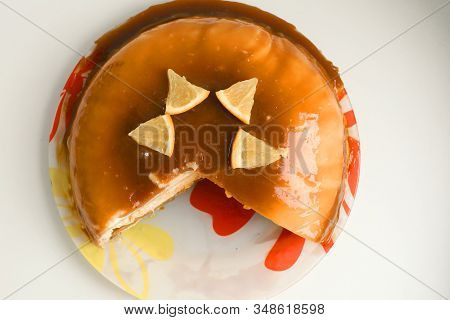 Cut Orange Caramel Mousse Cake With Cream Cheese Mascapone And Chocolate Glaze With Orange Pieces Cl