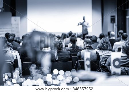 Male Public Peaker Giving Presentation On Business Conference Event.