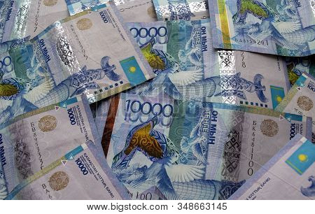 Kazakhstan National Currency, Top View Of Mixed Tenge Banknotes. Ten Thousand Tenge. Kz Paper Money.