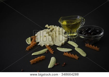 Different Spaghetti With Olive Oil On Black Background. Top View. Pasta.