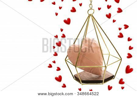 The Red Small Hearts Overflow Around The Pink Heart Enter The Gold Cage, And Fly Upwind.on White Bac