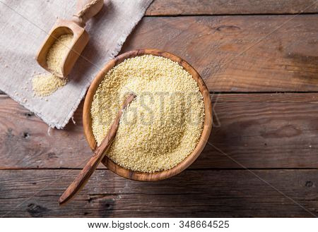 Couscous Grain In Wooden Bowl. Top View Couscous  Seeds