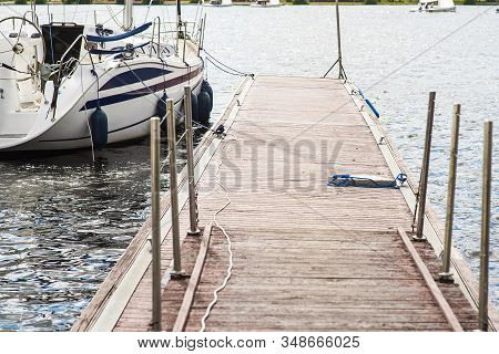 A Mooring With A Mooring Line Tied Around It With Boats And Ships In The Background In A Harbour Moo