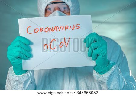 Epidemiologist Holding Coronavirus Bcov Paper Banner In Quarantine, Selective Focus