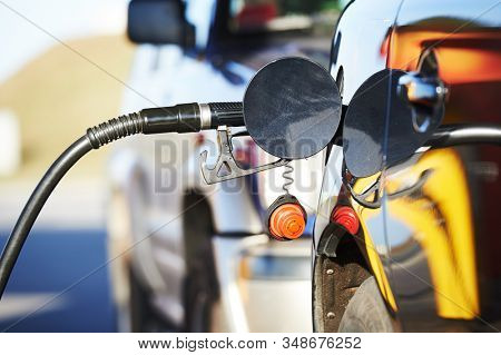 Fuelling diesel fuel into automobile at filling station