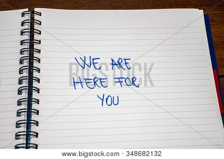 We Are Here For You Handwriting  Text On Paper, On Office Agenda. Copy Space.