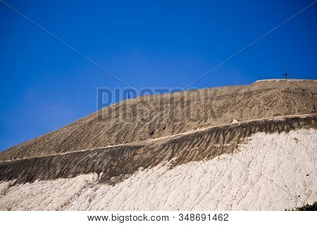 Extracting And Mining Potassium And Magnesium Salts.large Excavator Machine And Huge Mountains Of Wa