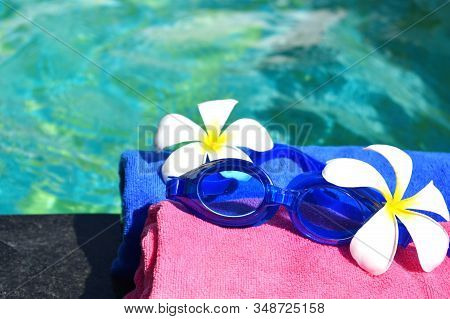 Water Glasses And A Swimming Pool. The Concept Of Tropical Relaxation. Vacation In A Spa Resort. Spa