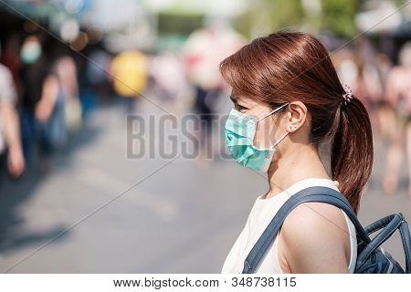 Young Asian Woman Wearing Protection Mask Against Novel Coronavirus (2019-ncov) Or Wuhan Coronavirus
