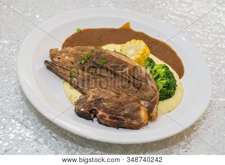 Grilled Lamb Chops With Broccoli, Corn, Mashed Potato And Black Pepper Sauce