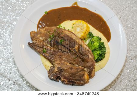 Grilled Lamb Chops With Broccoli, Corn, Mashed Potato And Black Pepper Sauce